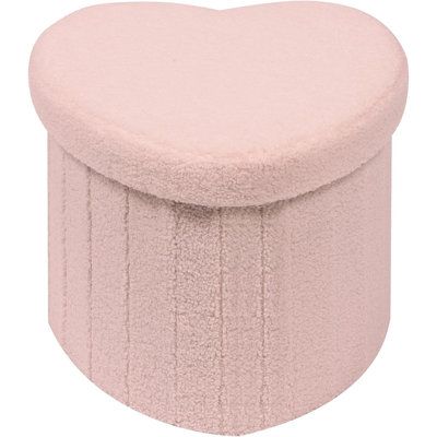 a pink heart shaped stool on a white background