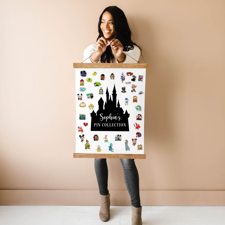 a woman is holding up a poster with disney's pin collection stickers on it