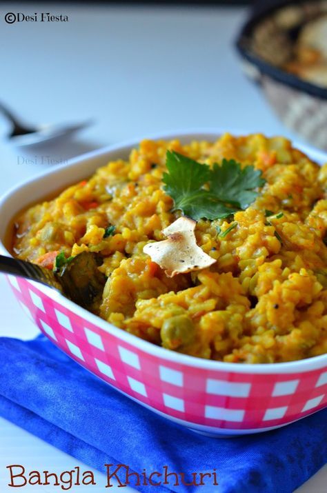 a bowl filled with rice and vegetables on top of a table