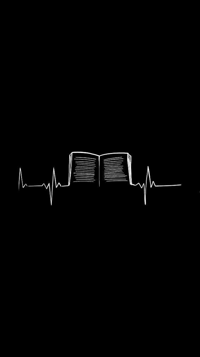 an open book on top of a heartbeat line