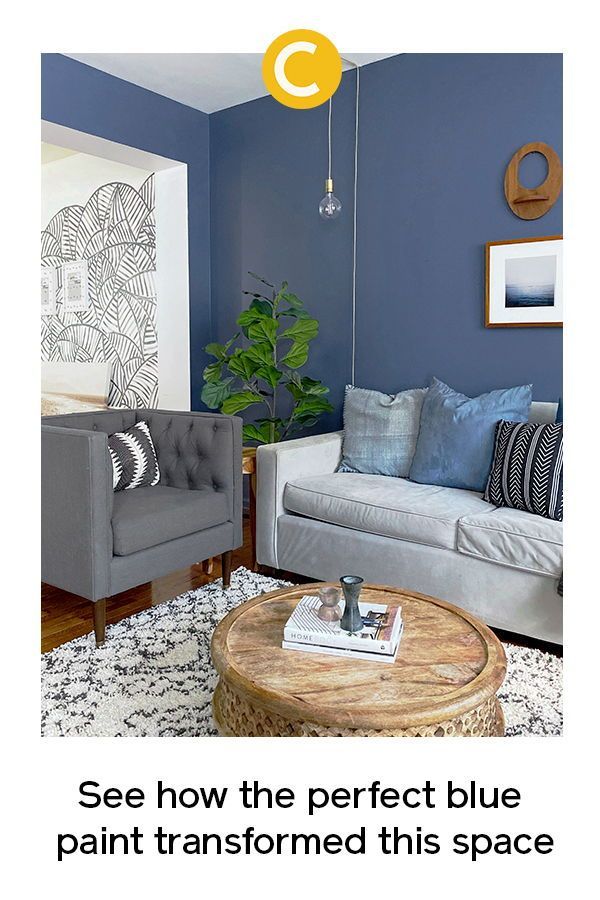 a living room with blue walls and white furniture in it, the text says see how the perfect blue paint transformed this space