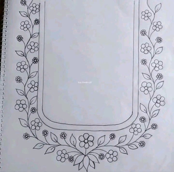 a drawing of a frame with flowers and leaves around it on top of a piece of paper