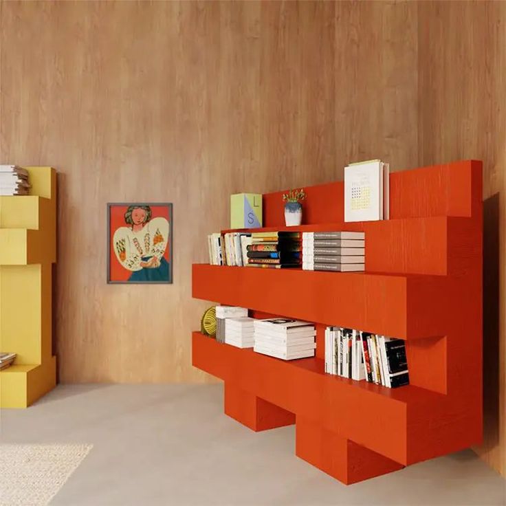 an orange book shelf in the corner of a room