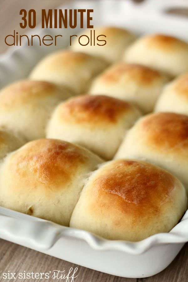 rolls in a white baking dish with the words 30 minute dinner rolls on it's side