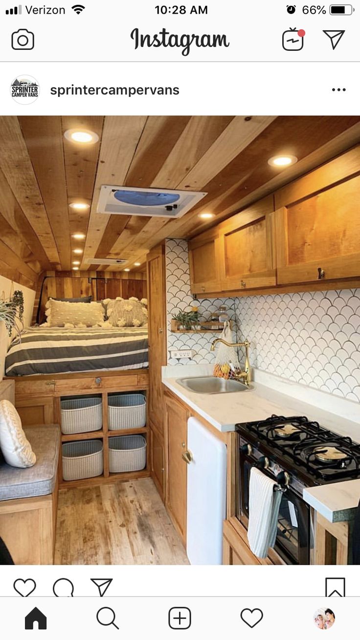 the interior of a small camper with wood paneling and white tile on the walls