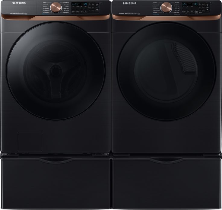 the front load washer and dryer are shown in black, with copper accents