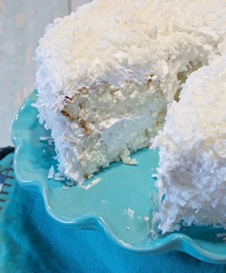 a close up of a cake on a plate with one slice taken out of it