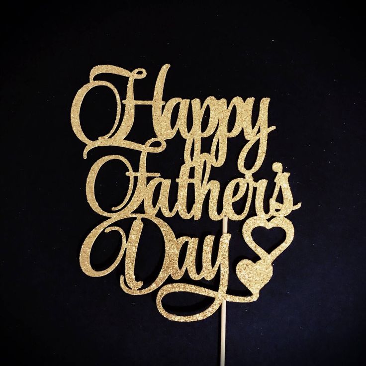 a happy father's day cake topper on a black background with gold glitter