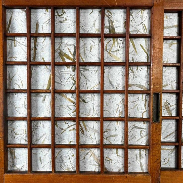 an old wooden door with glass panels on it