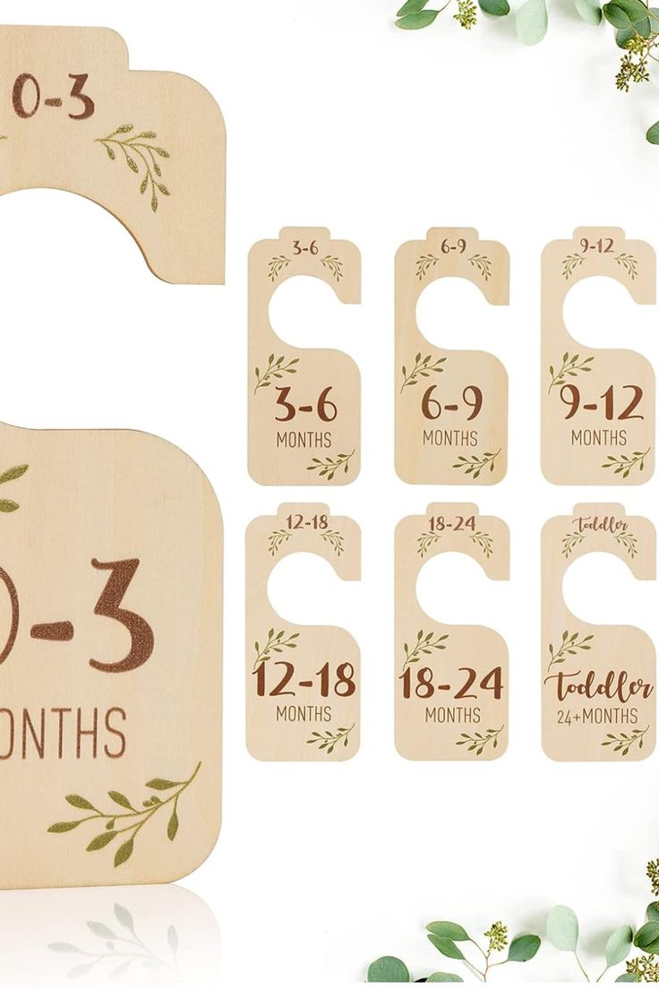 personalized wooden door hangers for baby's first birthday with numbers and leaves