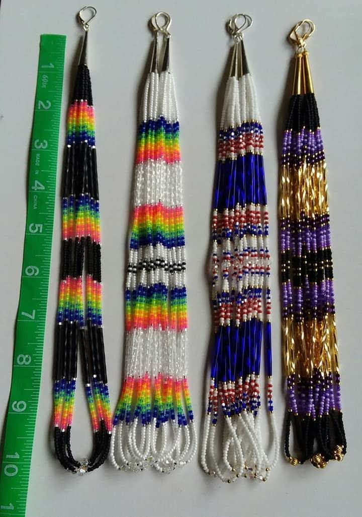 three different types of beaded necklaces next to a ruler