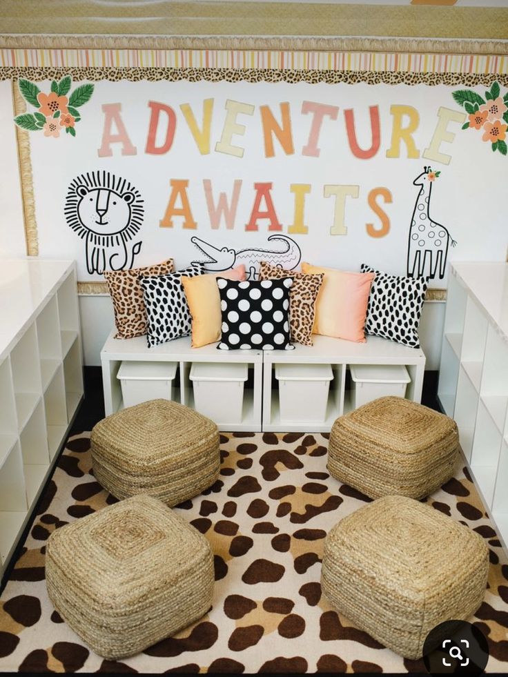 a room with several pillows on the floor and two stools in front of it