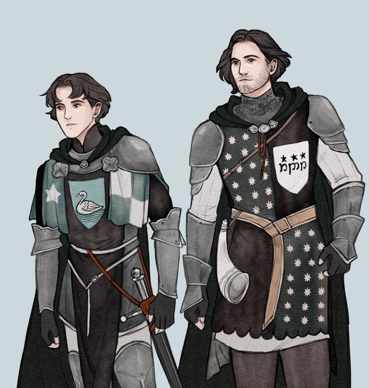 two men dressed in medieval armor standing next to each other