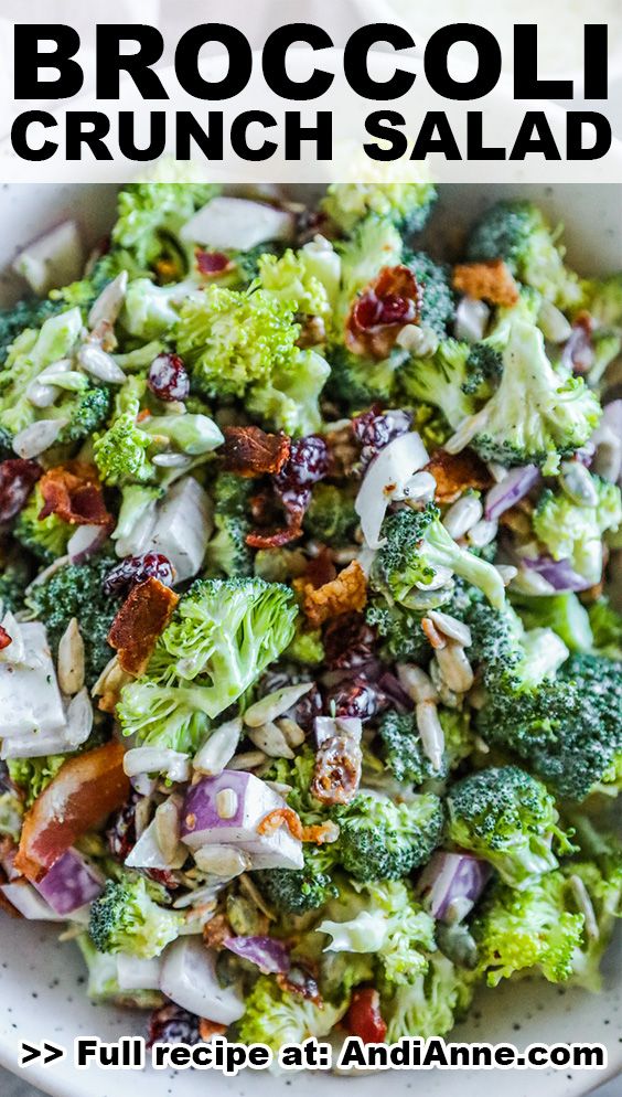 broccoli and cranberry salad in a white bowl with text overlay