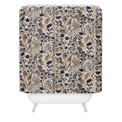 a shower curtain with a floral pattern on the outside and blue, brown, and white colors