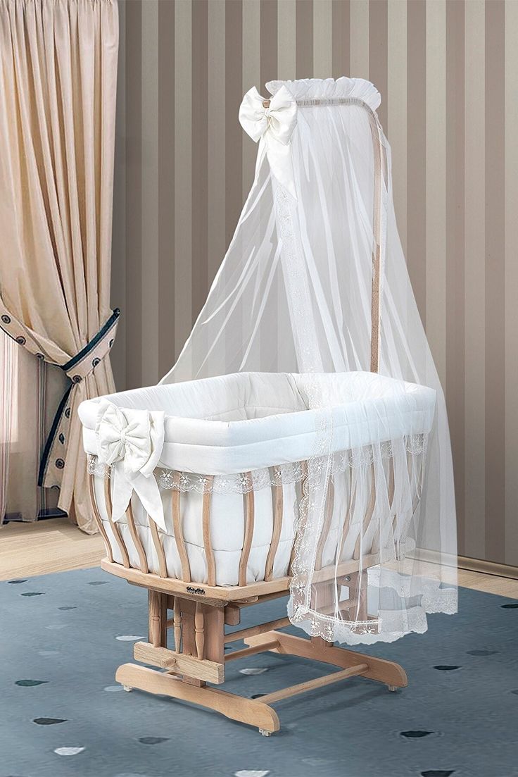 a baby crib with a mosquito net over it