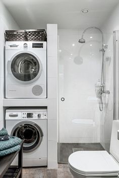 a washer and dryer in a small bathroom