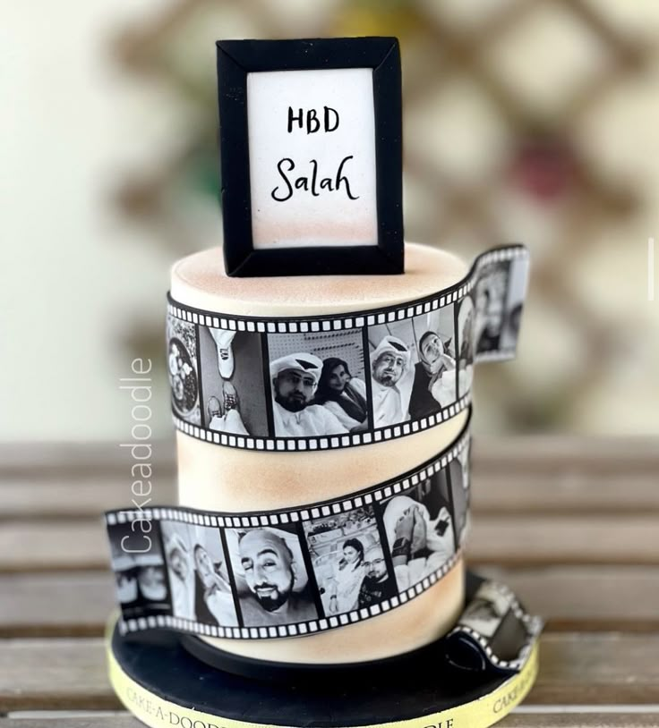 a film strip cake with pictures on it