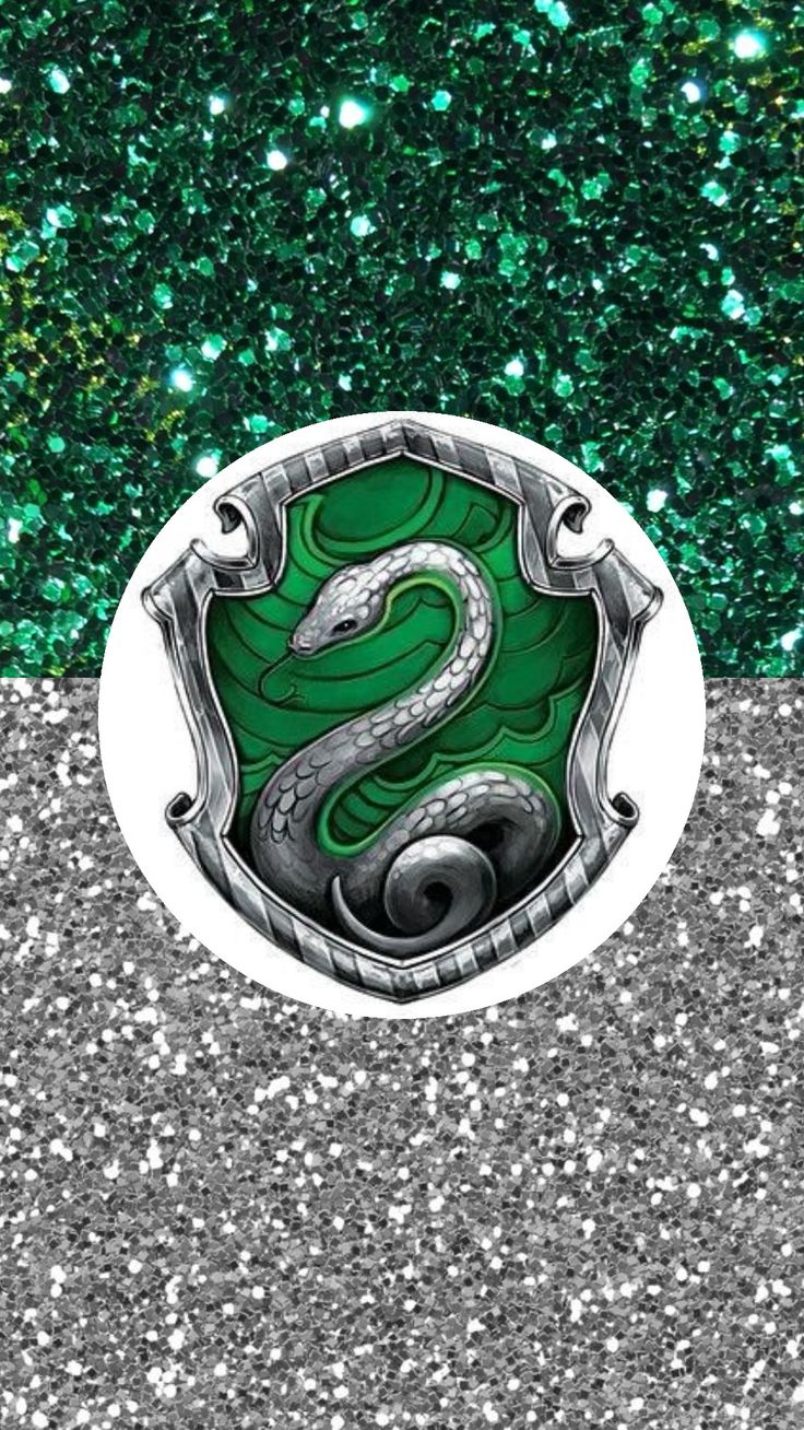 a green and white snake emblem on the side of a road with glitters in the background