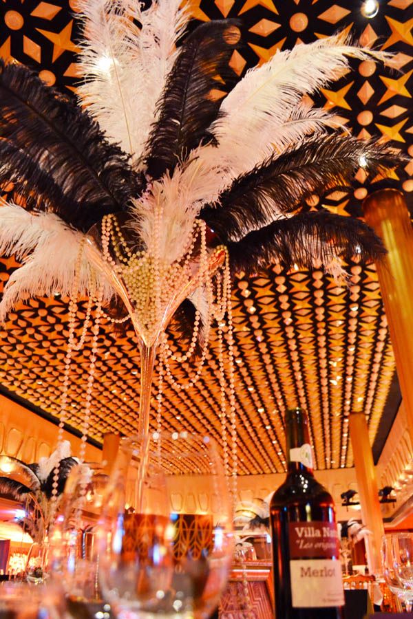 a fancy chandelier hanging from the ceiling in a restaurant