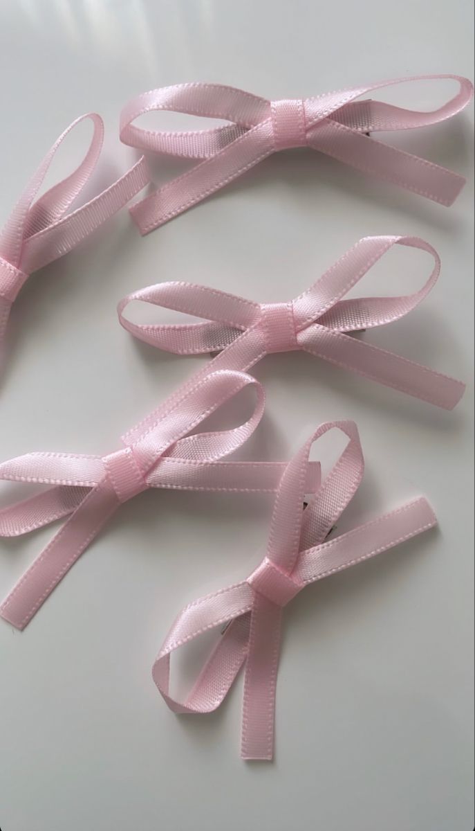 pink ribbon on white surface with no background