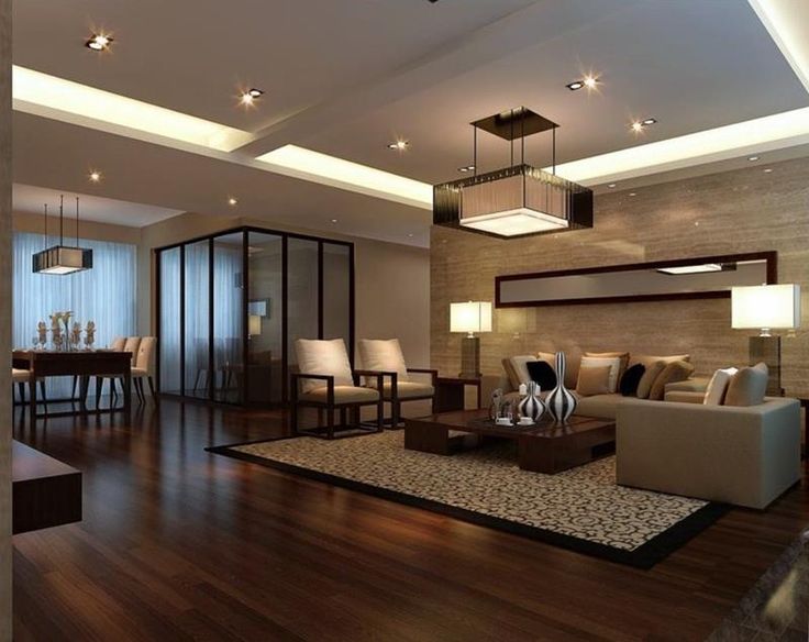 a living room filled with lots of furniture next to a dining table and two chairs