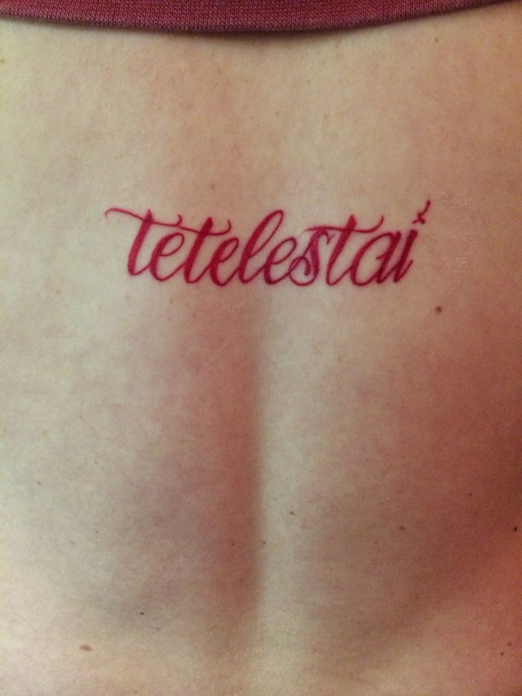 a woman's back with the word tetlestat written on her left side