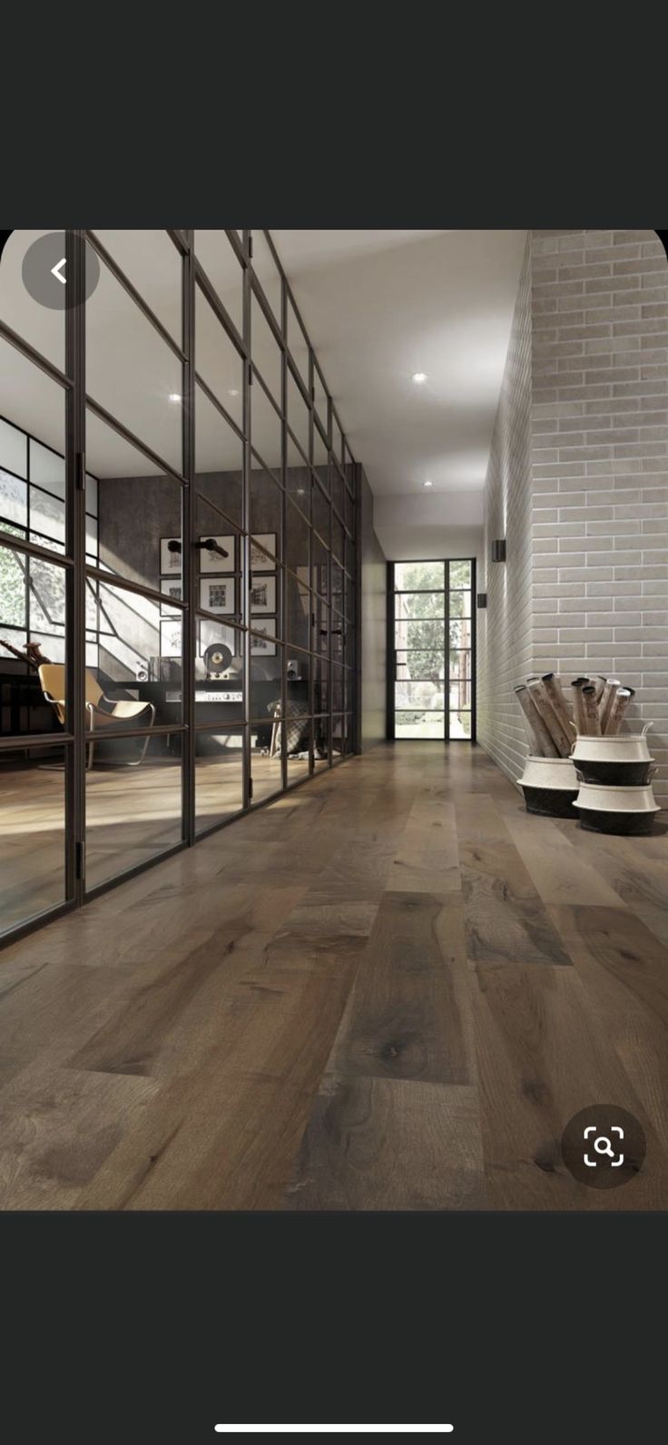 an image of a room with wood floors and glass doors on the wall, in front of a large window