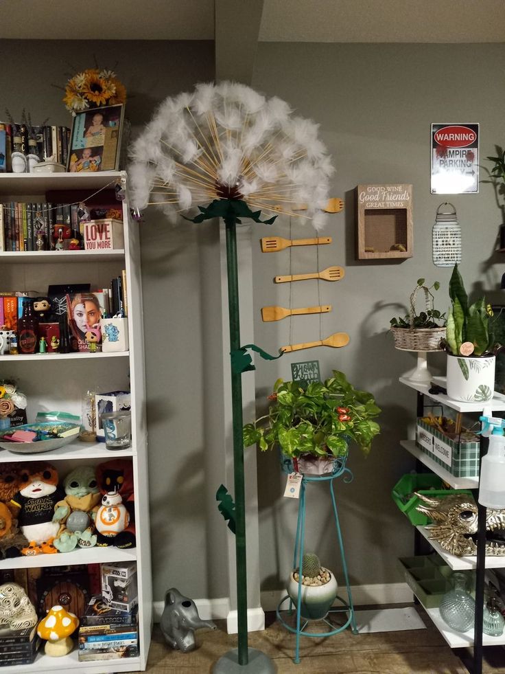 a room filled with lots of plants and books