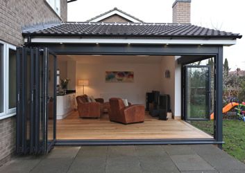 an outdoor living area with sliding glass doors