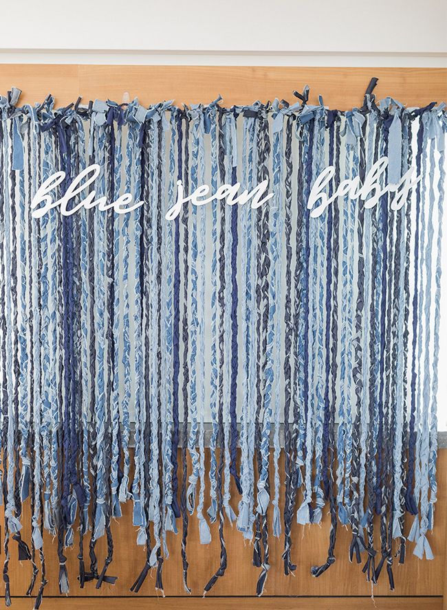 the words be very good are written on blue and white striped fabric hanging from a wooden door