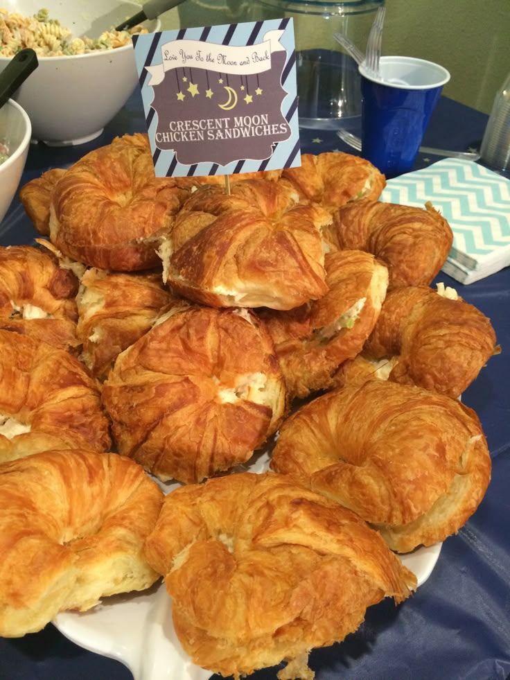 there are many croissants on the table ready to be eaten and served