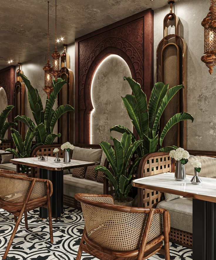 the interior of a restaurant with tables, chairs and potted plants in front of them