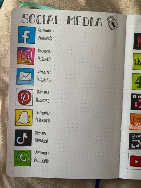 an open notebook with social media icons on it