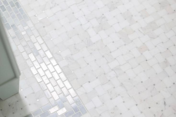 a bathroom with a toilet and tiled floor