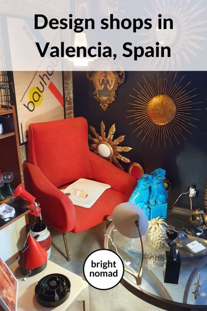 a red chair sitting in front of a glass table with bottles on it and the words design shops in valencia, spain