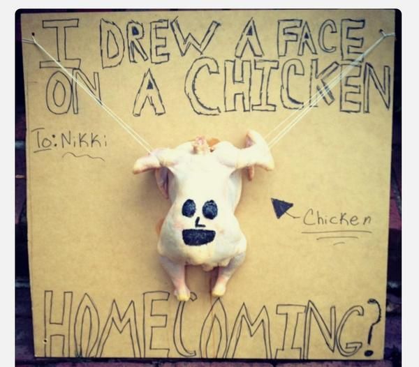 a fake animal hanging from a sign with writing on it's face and the words, i drew a face on a chicken home coming?