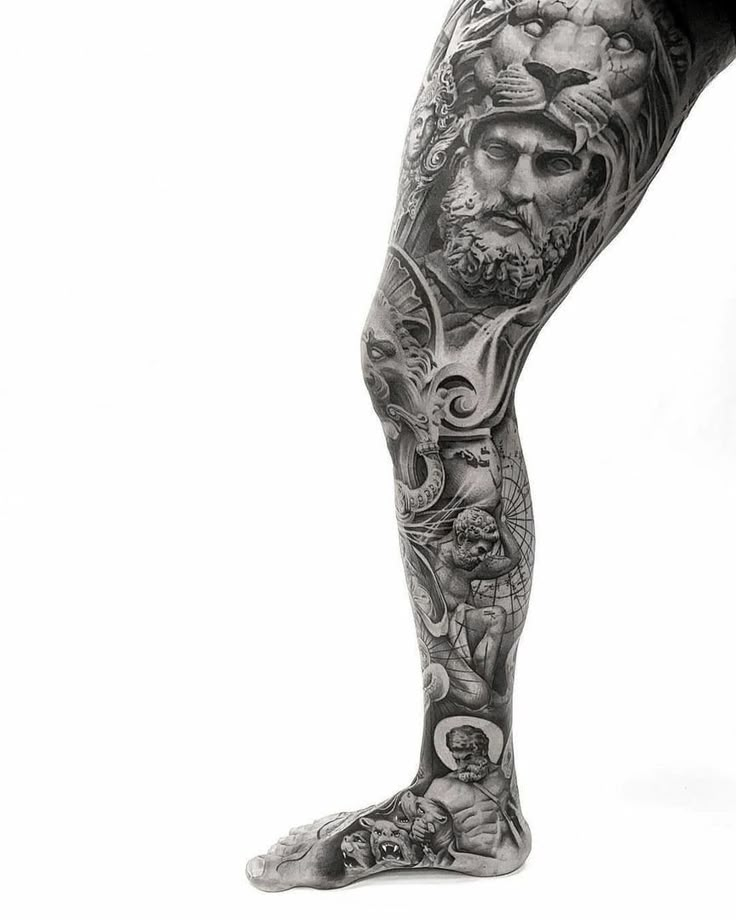 a man's leg with tattoos on it