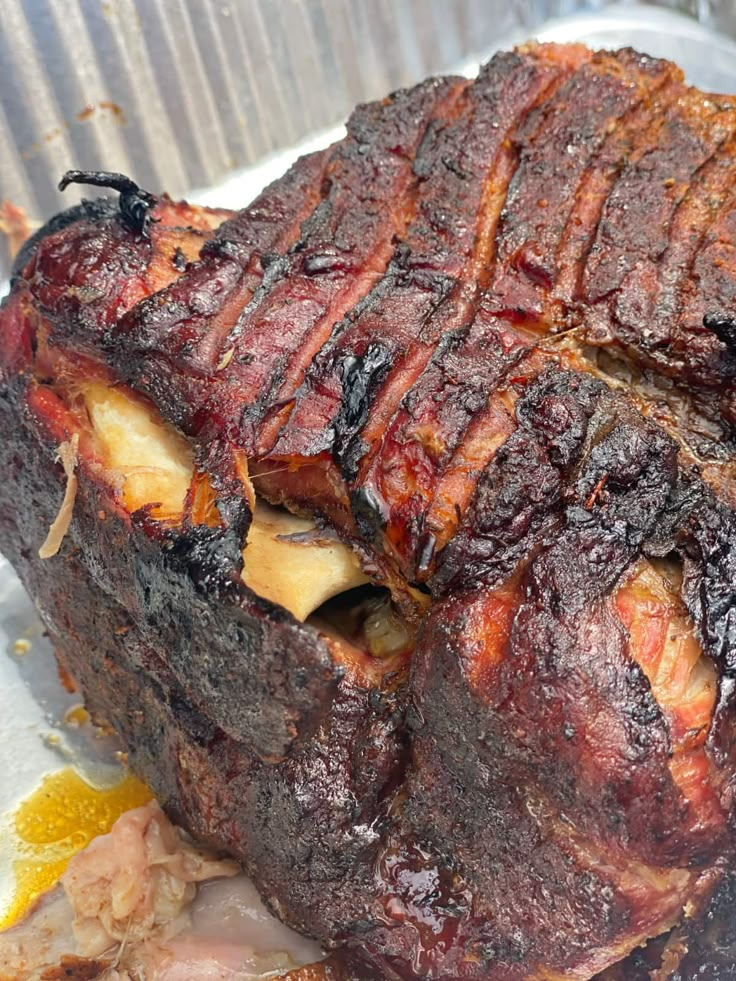 a large piece of meat sitting on top of a pan