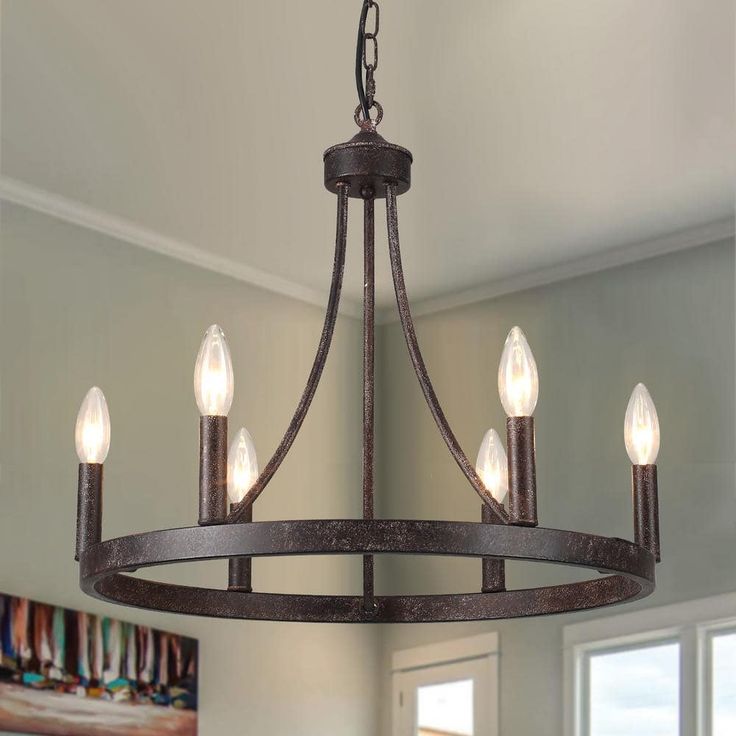 This modern farmhouse dining chandelier has a 59 in hanging chain so you can customize the length to get the perfect height. If you are looking for a ceiling for sloped ceiling, slanted ceiling, flat ceiling, or vaulted ceilings, this wagon wheel chandelier will be a good option. This Lighting Fixtures Hanging can make your home more retro farmhouse style, which is perfect for a farmhouse, dining room, living room, kitchen, barn, living room, entryway, or foyer. Farmhouse Dining Chandelier, Modern Rustic Chandelier, Farmhouse Candle, Farmhouse Candles, Hall Lighting, Black Farmhouse, Modern Farmhouse Dining, Dining Chandelier, Chandelier For Living Room