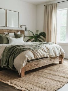 a bedroom with a large bed and two mirrors on the wall