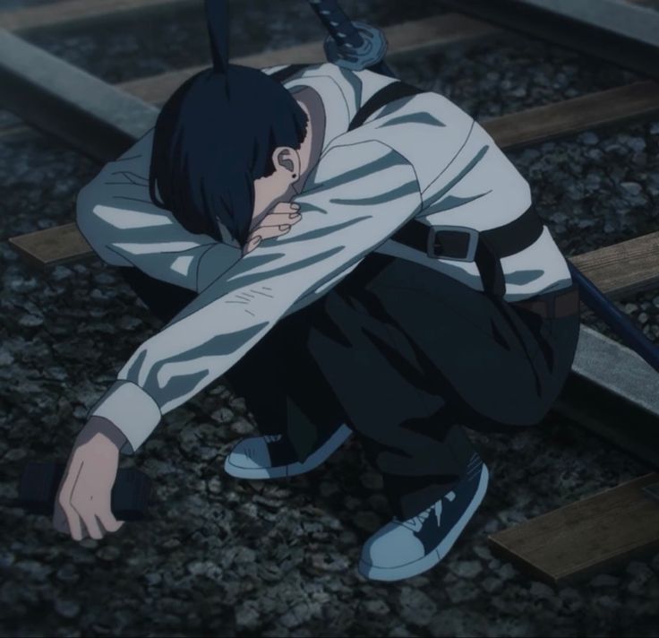 an anime character kneeling down on the ground