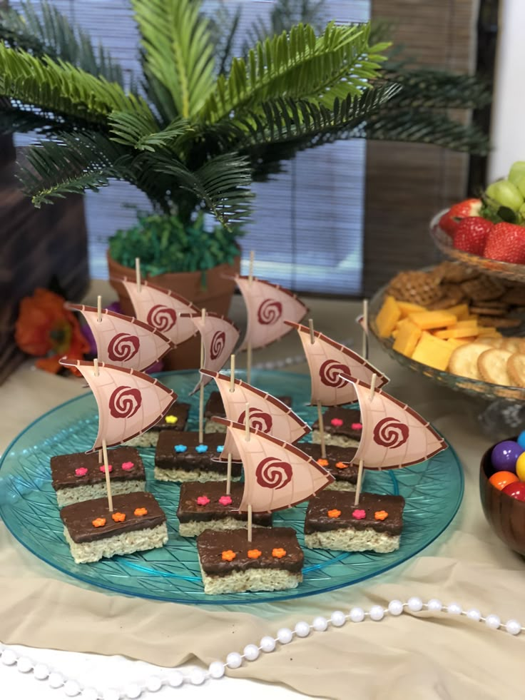 a table topped with lots of food and desserts