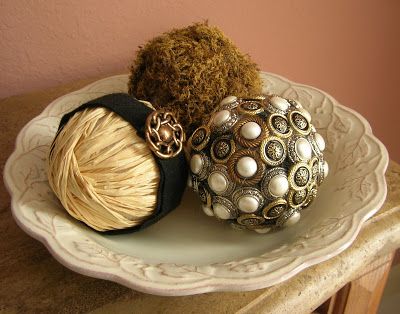 three balls of yarn are sitting on a plate