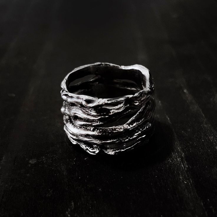 The Thicket Ring features a wrapped branch twig design in an infinite loop. The thicket ring is inspired by the dark woods of the black forest in southwest Germany.Ring is made of solid sterling silver (.925), oxidized to show detail. Due to the ring being rather tall, it is advised that you size up half a ring size from your normal size in order to properly fit this ring.The handmade nature of our items means that no two rings are exactly alike. All of our Jewelry at Remains is made to order an Dark Rings, Trio Necklace, Dark Woods, The Black Forest, Dark Jewelry, Walmart Jewelry, Rock Jewelry, Skull Necklace, Matching Rings