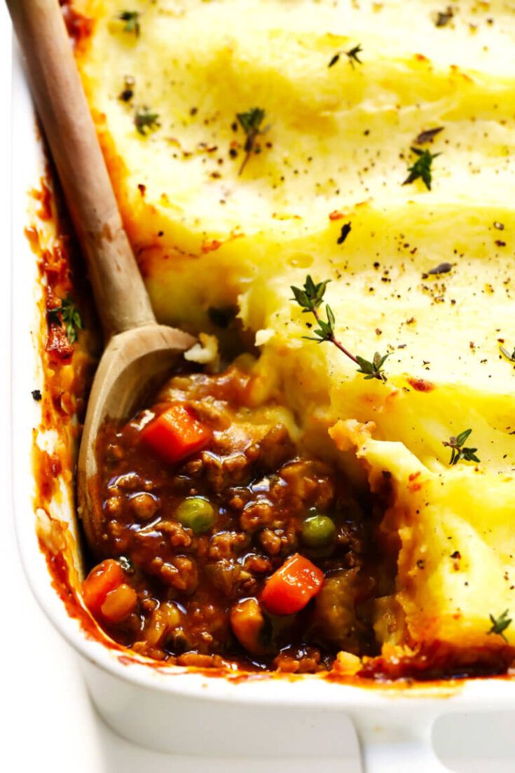 a casserole dish with meat and vegetables in it