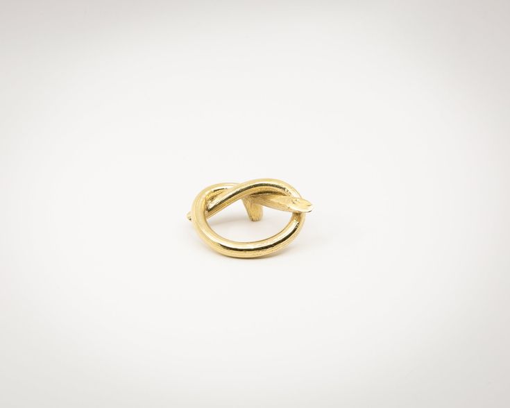 a gold ring on a white background