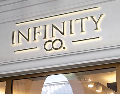 a sign that says infinity co on the side of a store front window