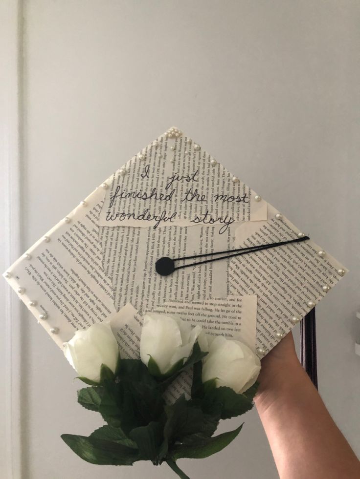 a graduation cap made out of books and flowers