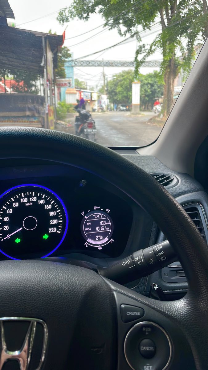 the dashboard of a car with gauges showing